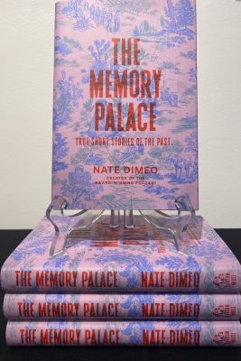 Stack of books, “The Memory Palace: True Short Stories of the Past” 